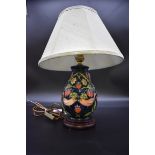 A contemporary Moorcroft 'Strawberry Thief' pattern table lamp, height including shade 41cm.