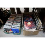 A large collection of 45rpm and 33rpm vinyl records.