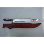 A large replica Indiana Jones Khyber Bowie knife and leather sheath, 45.5cm blade.