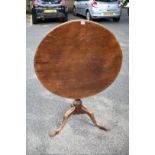 An old mahogany tripod table, 80cm wide.