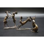 Three bronze figures of hares, largest 11.5cm high.