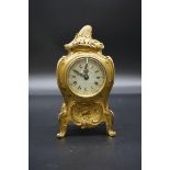 A Louis XV style cast brass cased mantel timepiece, in the Rococo style, 20cm high.