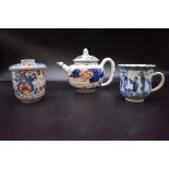 A Chinese Imari teapot and cover, 18th century, 12cm high; together with another Imari cup and