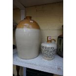 An old stoneware whisky flagon, inscribed 'E Gayton, 91 High St, Southampton', 19cm high; together