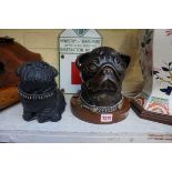 A bronzed resin Pug's head, 19.5cm high; together with another model of a pug. (2)