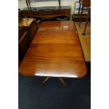 A good reproduction mahogany twin pedestal dining table, with two leaf insertions, 245.5cm extended.