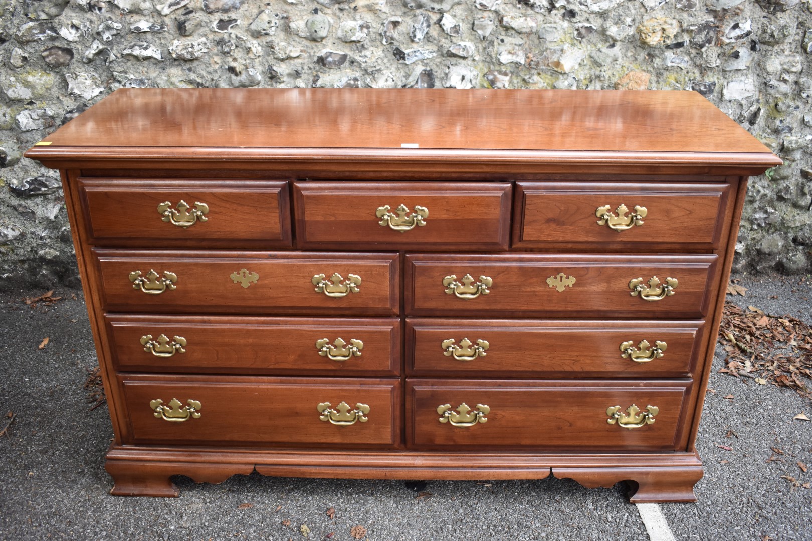 A large reproduction mahogany chest of drawers, by Dixie.