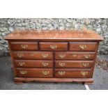 A large reproduction mahogany chest of drawers, by Dixie.