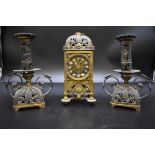 An unusual late 19th/early 20th century brass and plated metal clock garniture, height of clock