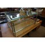 A vintage brass, plated metal and glass rectangular low two tier occasional table, 92cm wide.