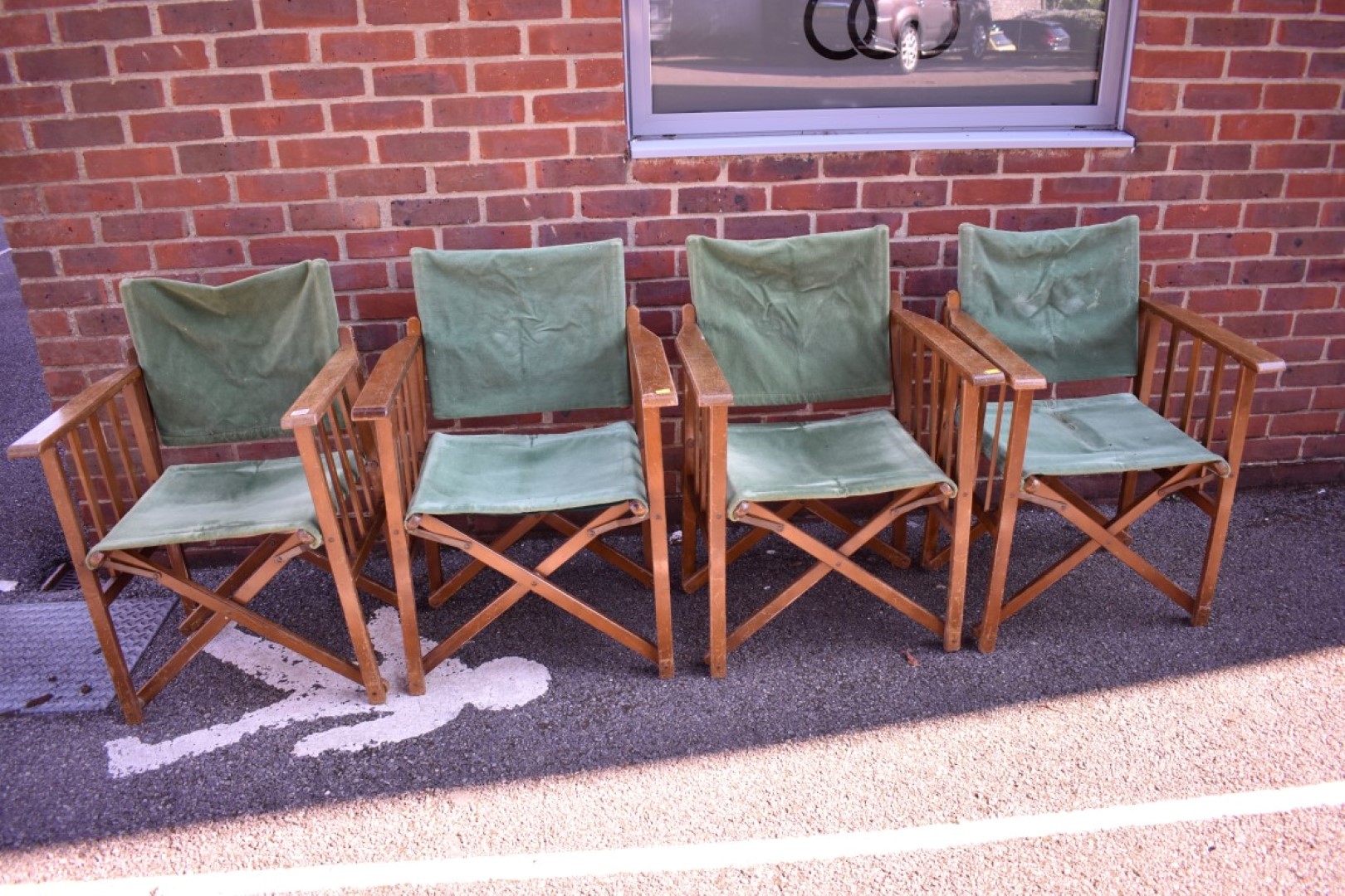 A set of four directors type chairs.