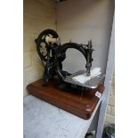 A Willcox & Gibbs sewing machine.