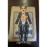 A scarce printed cardboard articulated 'Dancing Charlie (Chaplin) Illusion', in original paper bag