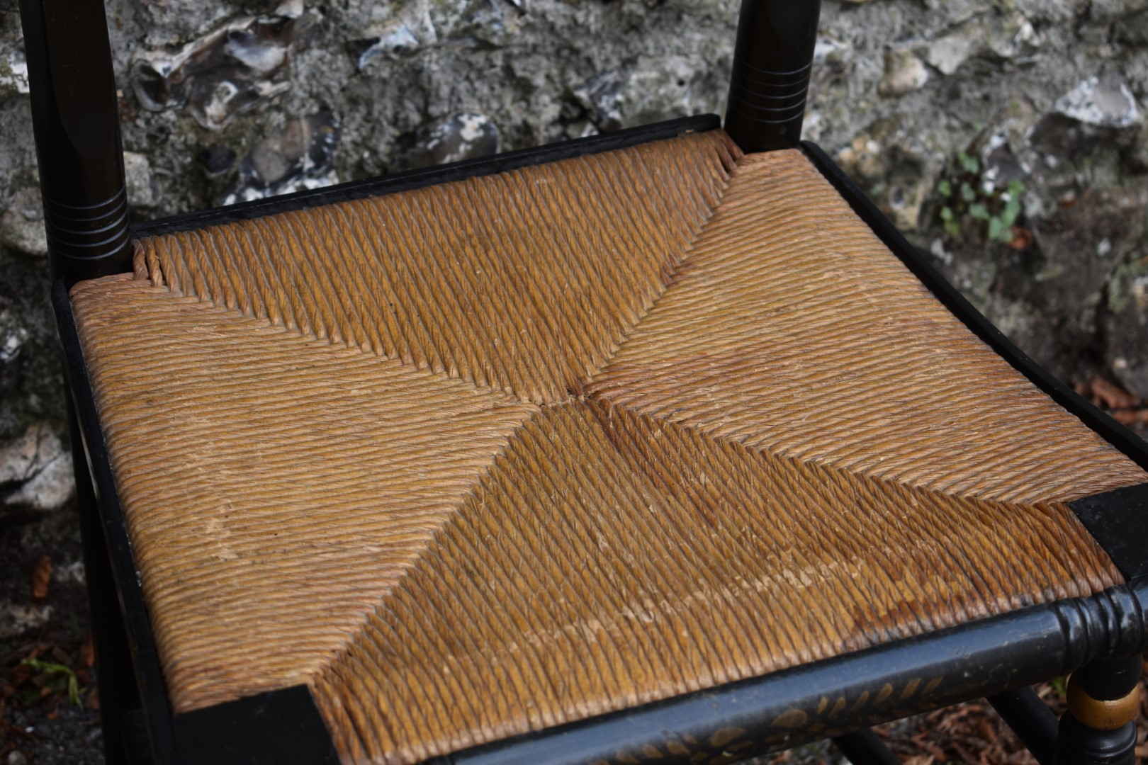 An ebonized cane seated chair, having gilt decoration. - Image 3 of 3