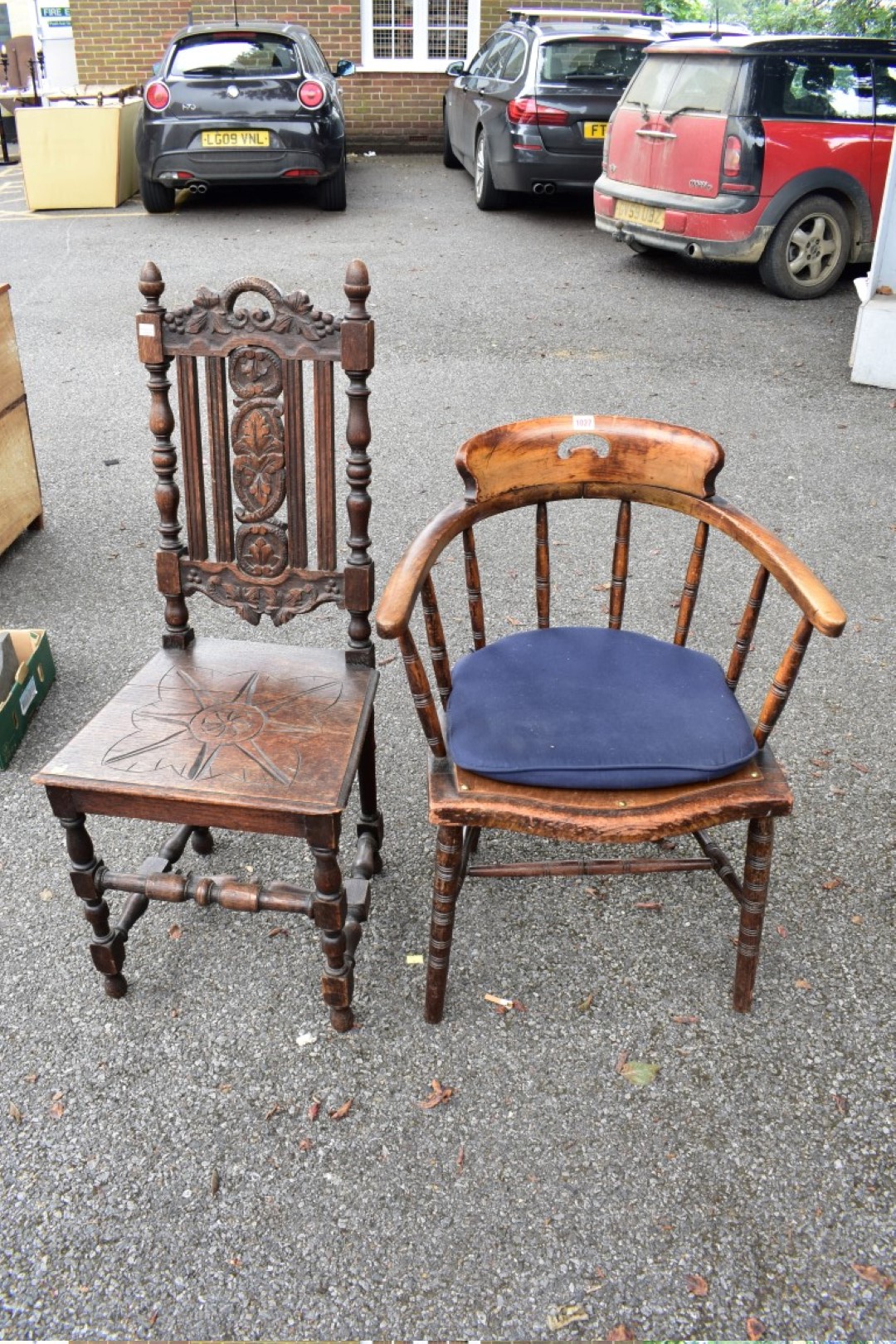 A circa 1880 carved oak chair; together with a desk type chair and an old trumpet work table.