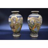 A pair of Japanese satsuma pottery vases, 22cm high.