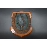 World War I Somme Interest: a horseshoe and spur, mounted on walnut shield, with traces of