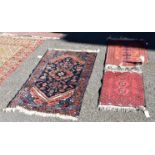 A small Persian rug, having central floral medallion, 124 x 78cm; together with two prayer rugs. (3)