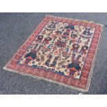 A Persian rug, having floral central field, with floral borders, 136 x 110cm.