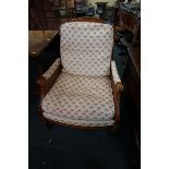 A good beechwood and upholstered bergere chair, by Wesley Barrel, with double caned arms.