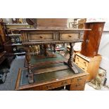 A small oak two drawer trestle table, 107cm wide.