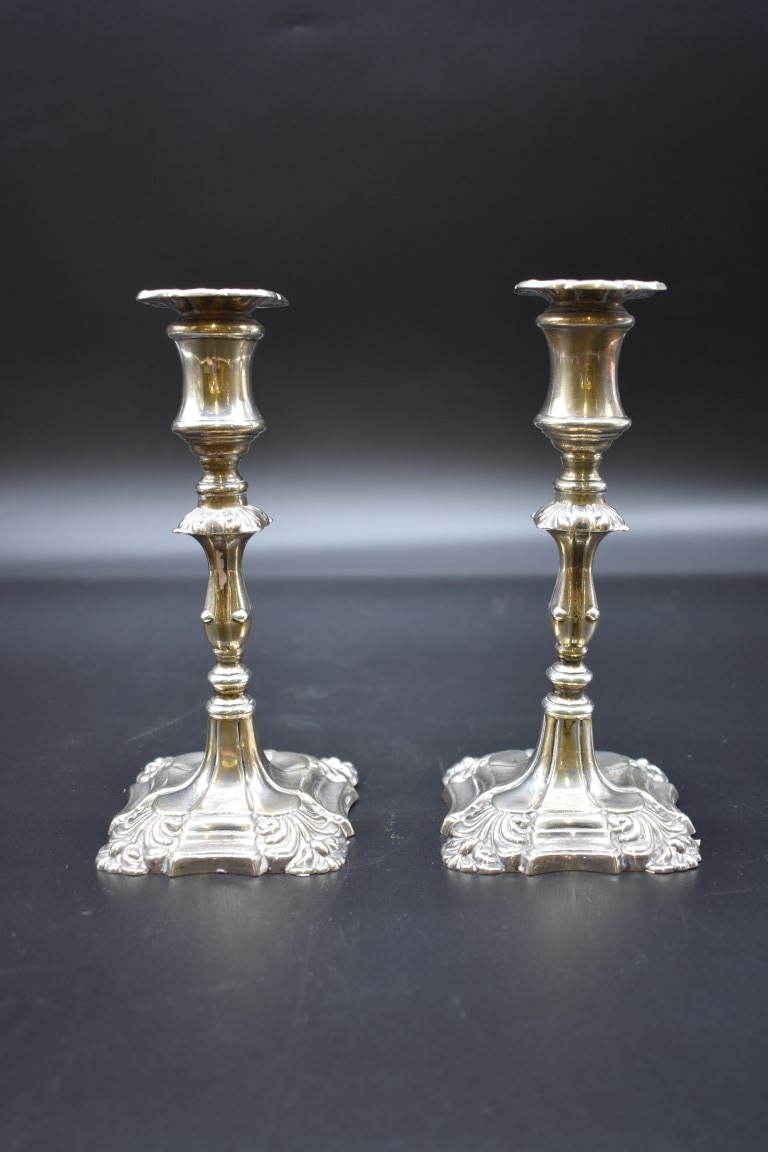 A pair of Georgian style silver candlesticks, by Walker & Hall, Sheffield 1928, 17cm, (weighted). (