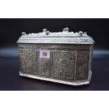 A large and impressive Burmese white metal casket, having chased and hammered decoration of hunts,
