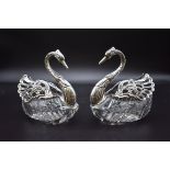 A pair of silver mounted cut glass swan bonbon dishes, import mark E Ltd, London 1976, 13cm high. (