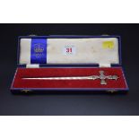 A cased silver Elizabeth II 1953 commemorative paper knife, by Atkin Brothers, Sheffield 1952, 21cm,