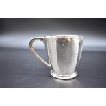 A silver christening mug, by Barker Brothers Silver Ltd, Birmingham 1931, 7cm high, 144g.