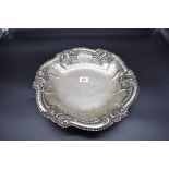 A continental white metal fruit bowl, stamped 800, having shell and scroll decorated rim, 33cm