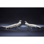 A pair of Continental white metal pheasants, having detachable heads, each stamped 800, largest