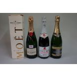 A 75cl bottle of Moet & Chandon NV champagne, in card box; together with another 75cl bottle of NV