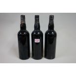 Three bottles of 1940s port, possibly Warre's 1948 vintage, good fill levels. (3)