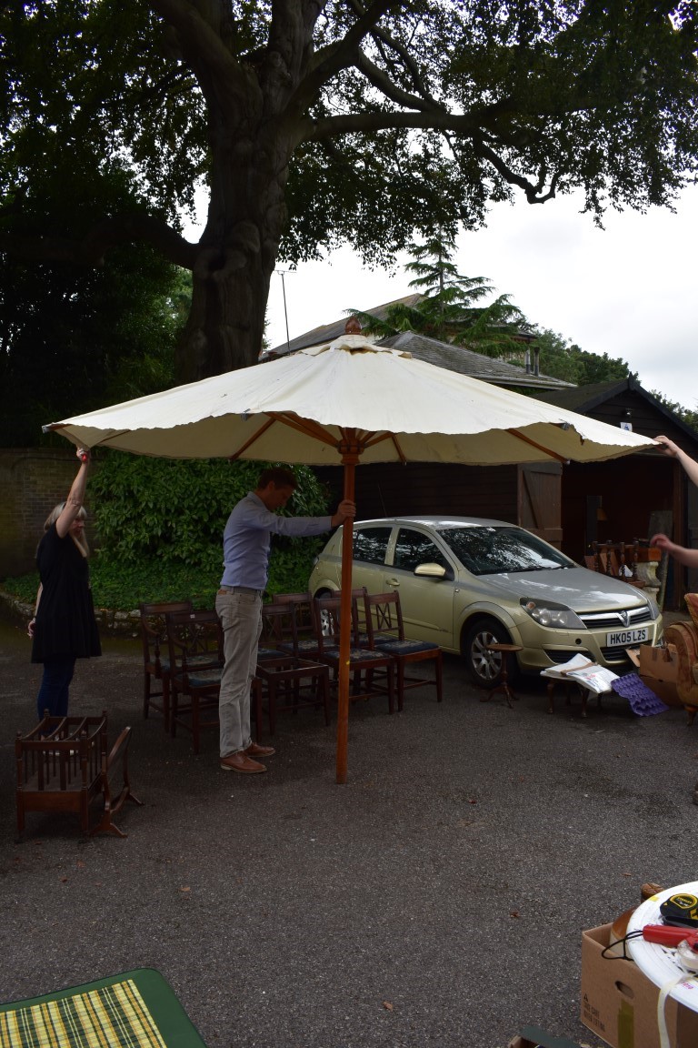 (LC) A large garden parasol, labelled Barlow Tyrie.