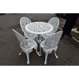 An aluminium white painted garden table; together with four matching chairs.