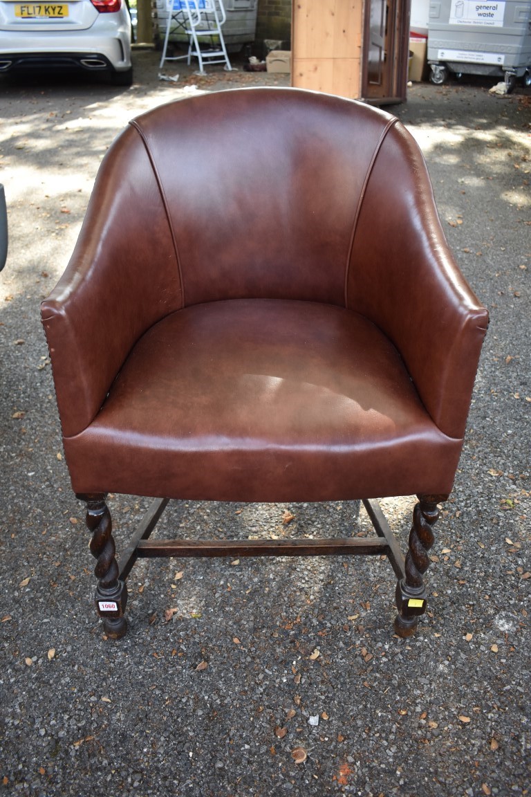 A 1920s oak and leather desk chair.