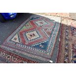 (LC) A Persian rug, having two central diamond medallions, with six stars to central field, 250 x