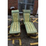 (LC) A pair of teak garden sun loungers.