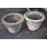 A pair of composition garden urns.