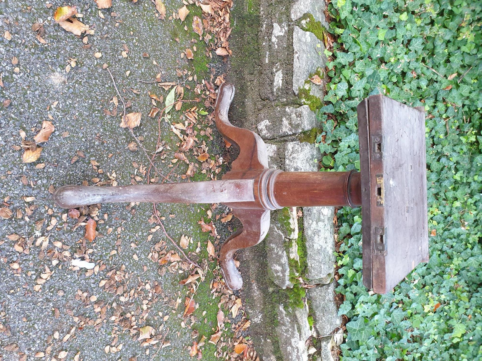 (LC) A 18th century mahogany tripod table base.