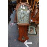 An antique Dutch oak wall clock, with arched painted dial, 128cm high, with pendulum.