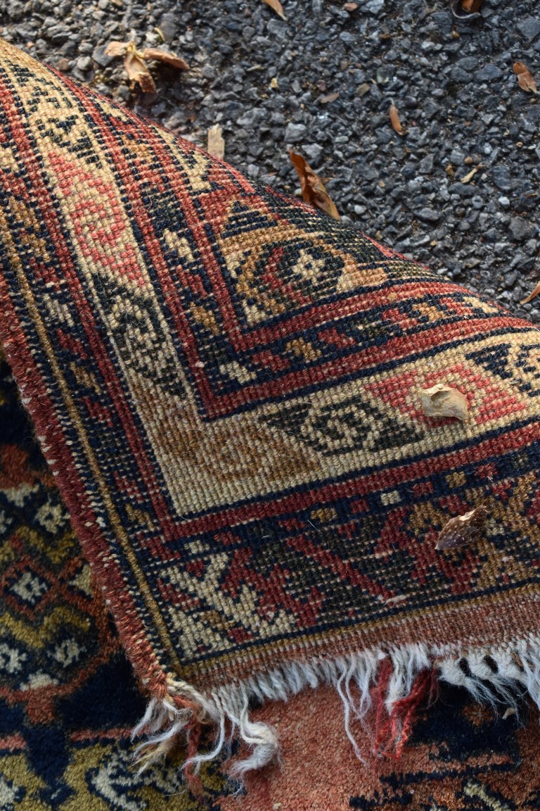 Two small Bokhara rugs; together with another small rug having geometric decoration. - Image 5 of 5