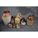 A quantity of stoneware bottles.