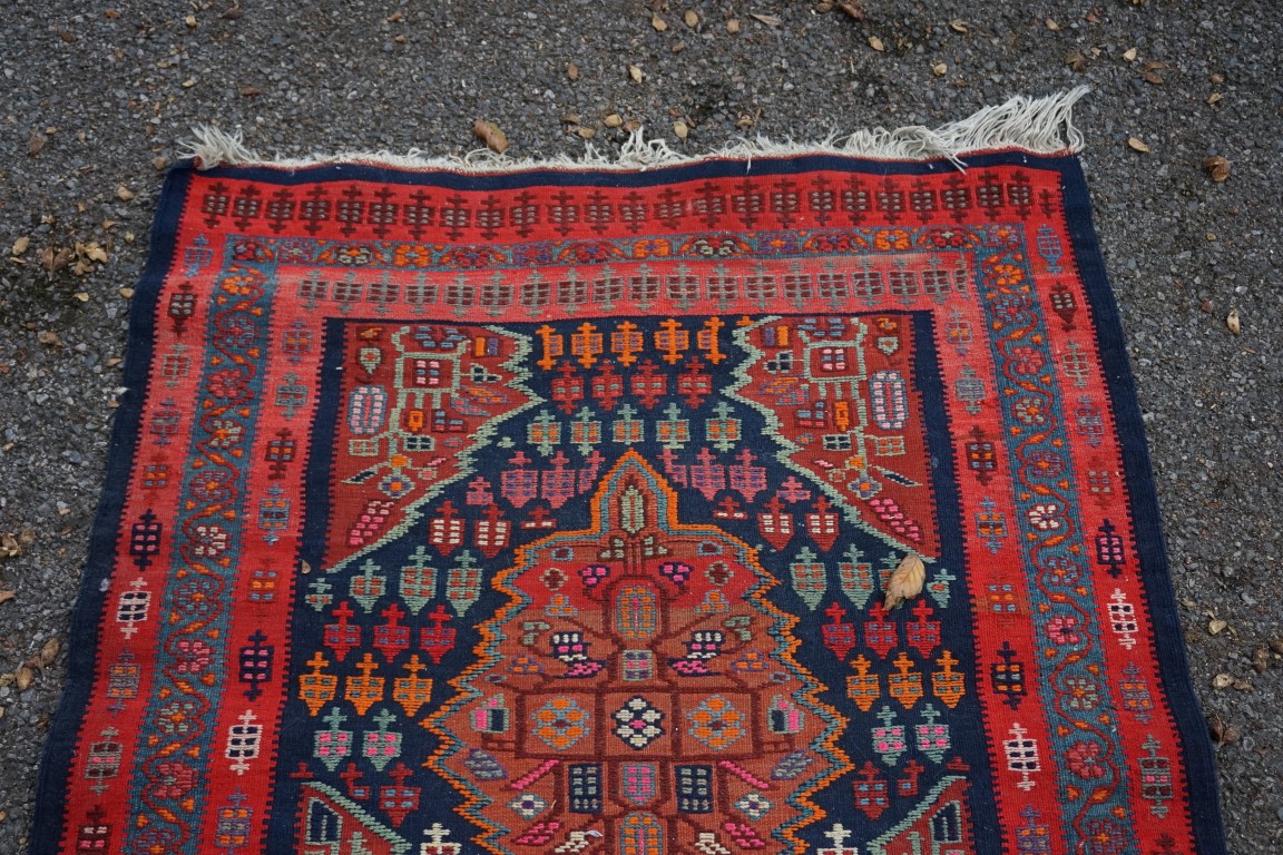 A long Tribal runner, having seven central medallions, with floral borders on a red and blue ground, - Image 10 of 10