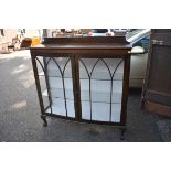 A 1920s mahogany bowfront display cabinet, 119cm wide.