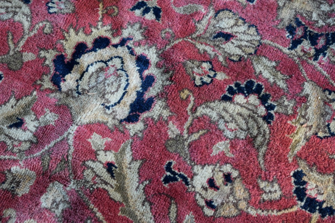 A floral rug, central field decorated with flowers and deer, with floral borders. - Image 2 of 3