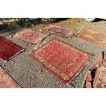 A square Persian rug, having repeated decoration to central field, 123 x 100; together with a pair
