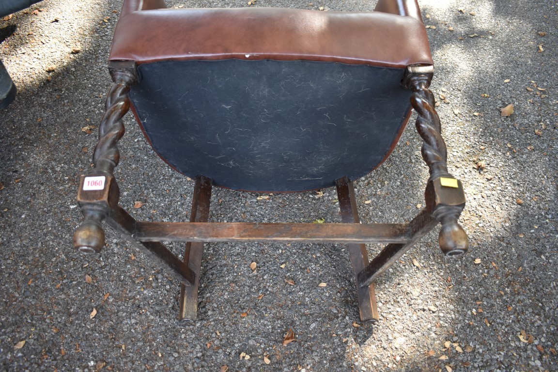 A 1920s oak and leather desk chair. - Image 2 of 2