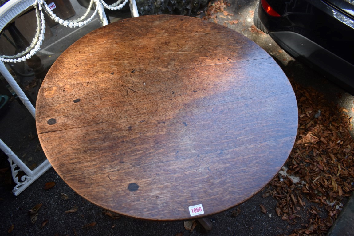 A George III oak circular tripod table. - Image 2 of 4